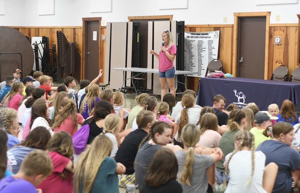 Students watching a Traveling Acres educational animal assembly